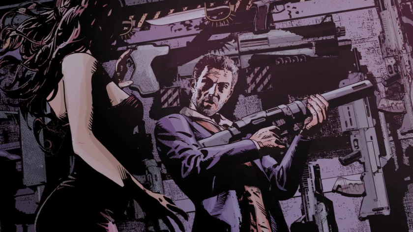 Woman and man standing in front of a wall of guns. Man is holding a gun